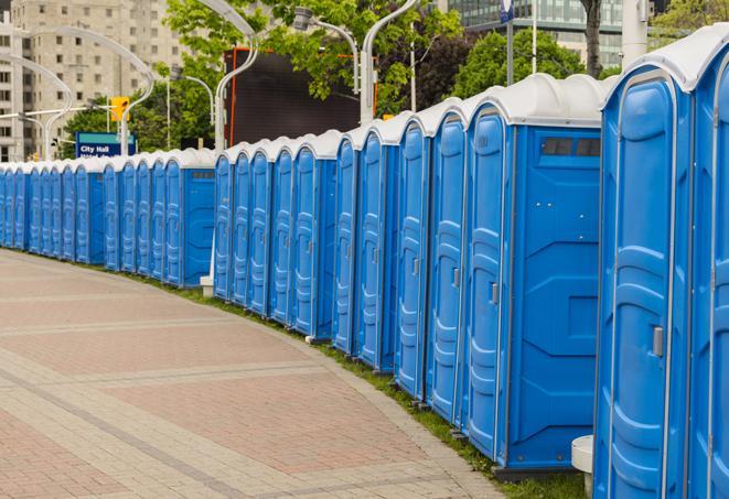 a row of portable restrooms at a fairground, offering visitors a clean and hassle-free experience in denton